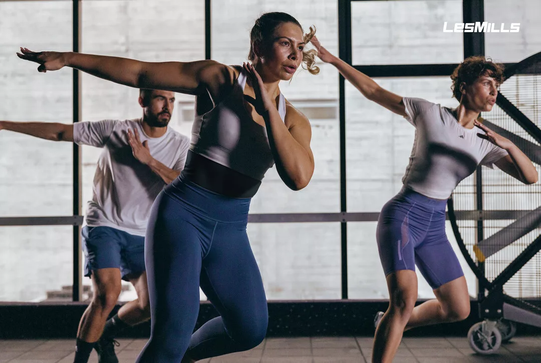 a group of people exercise together with intensity and coordination