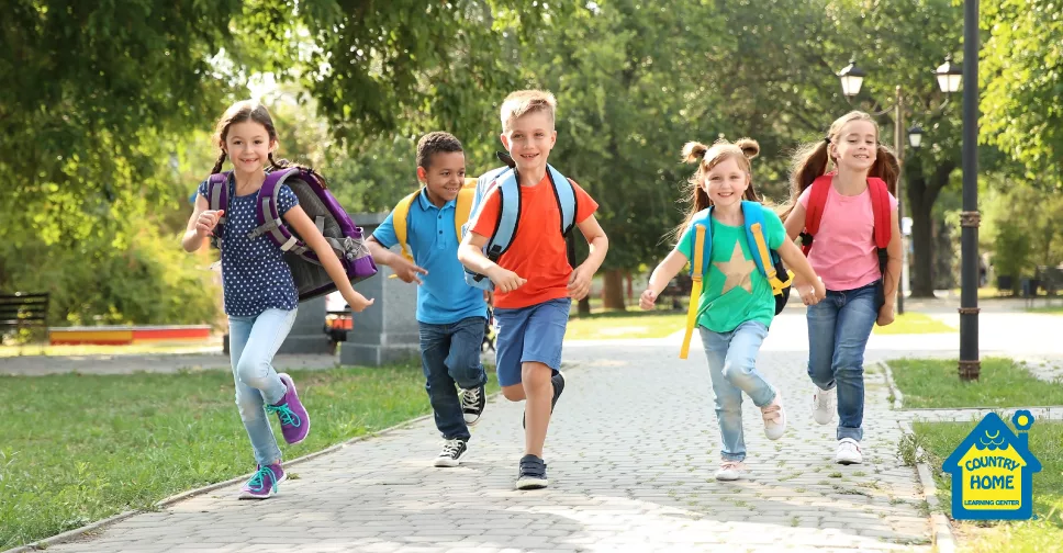 School kids smiling and running