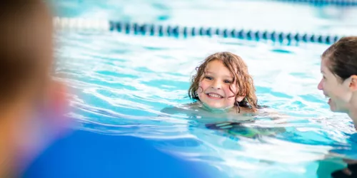 Kids learning to swim