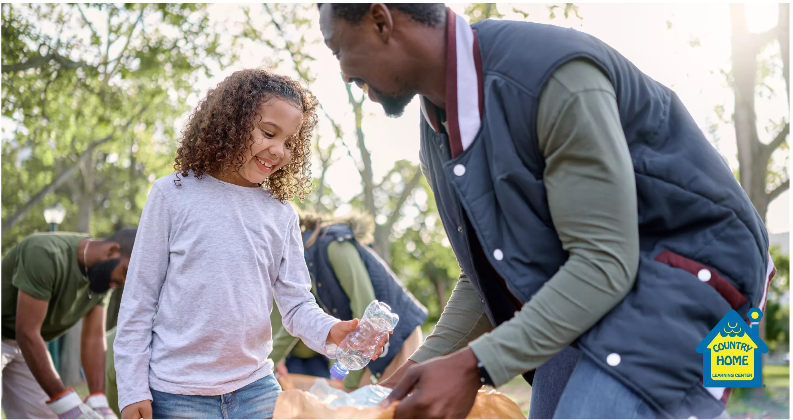 A father and daughter duo picks up trash with others
