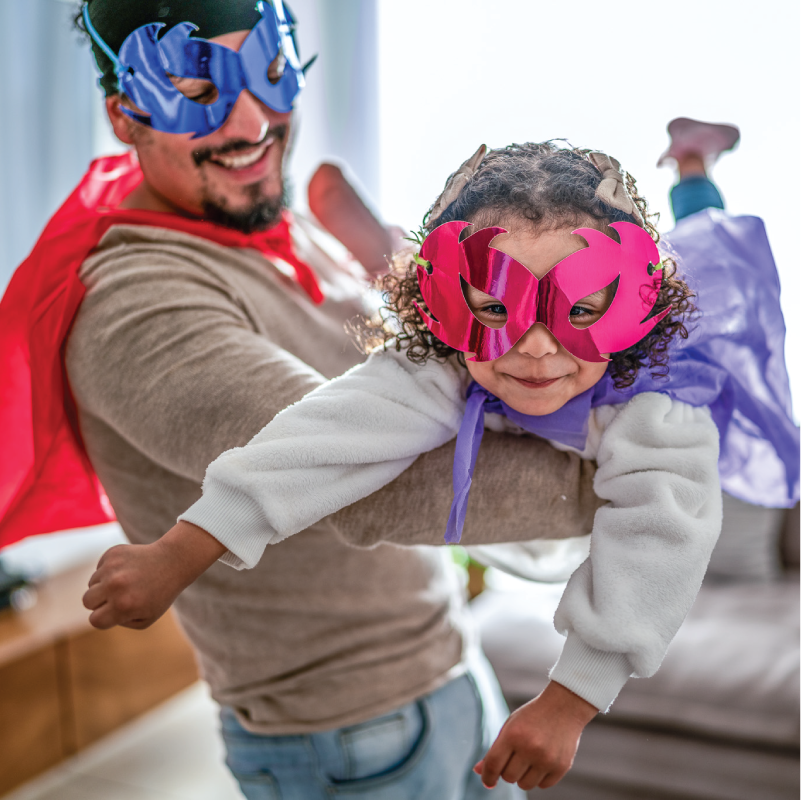 pretendplay2 A parent and child play make believe superheroes