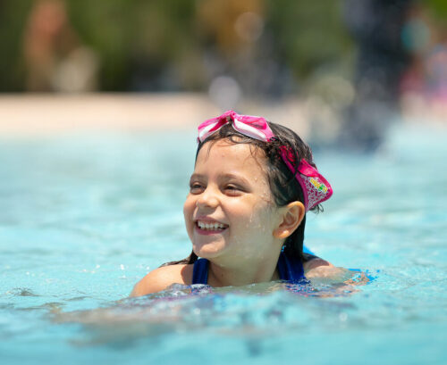 DSC09769 girl swimming in outdoor pool