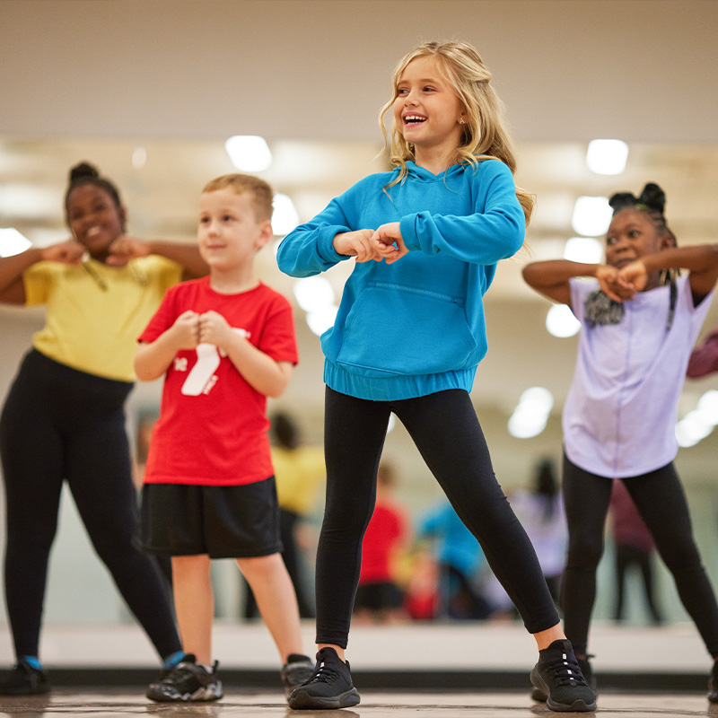 children play a game of youth soccer