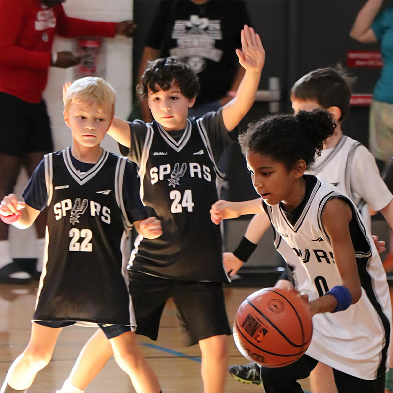 children play a game of youth soccer