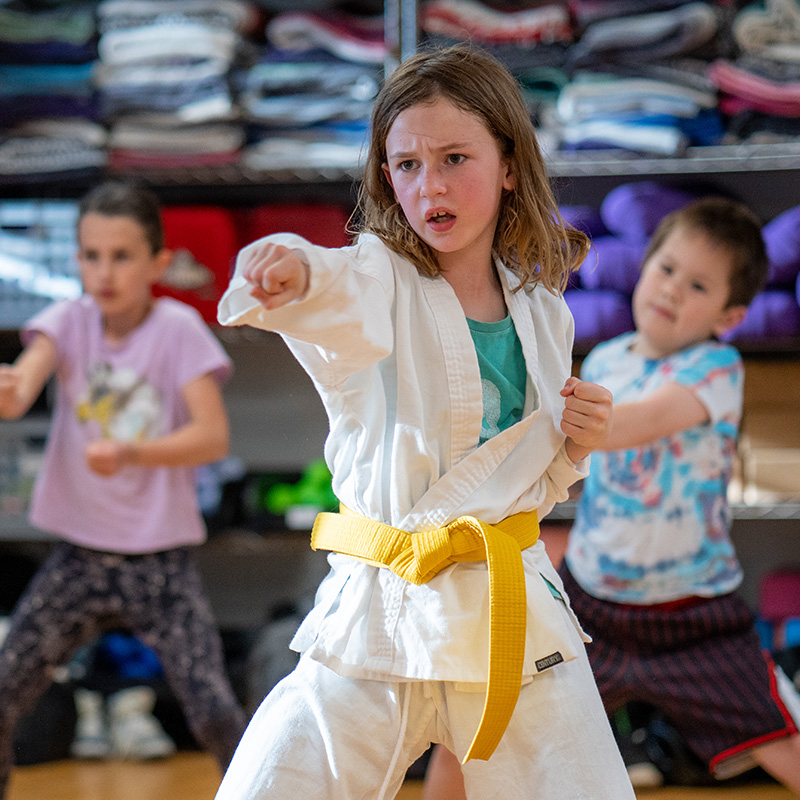 children play a game of youth soccer