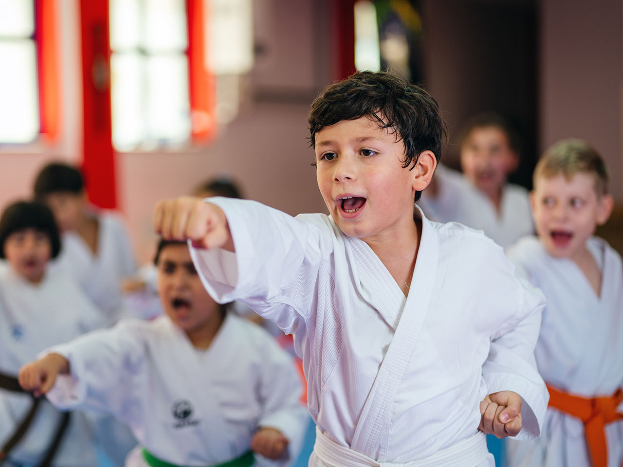 Children participate in a martial arts class.