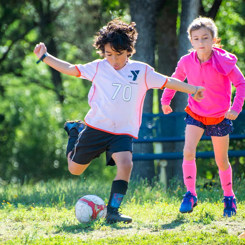 children play a game of youth soccer