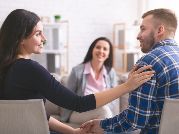 Couples Cousenling heterosexual couple on a couch connecting during counseling session