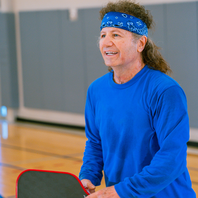 Older Adults people dance enthusiastically in a fitness class
