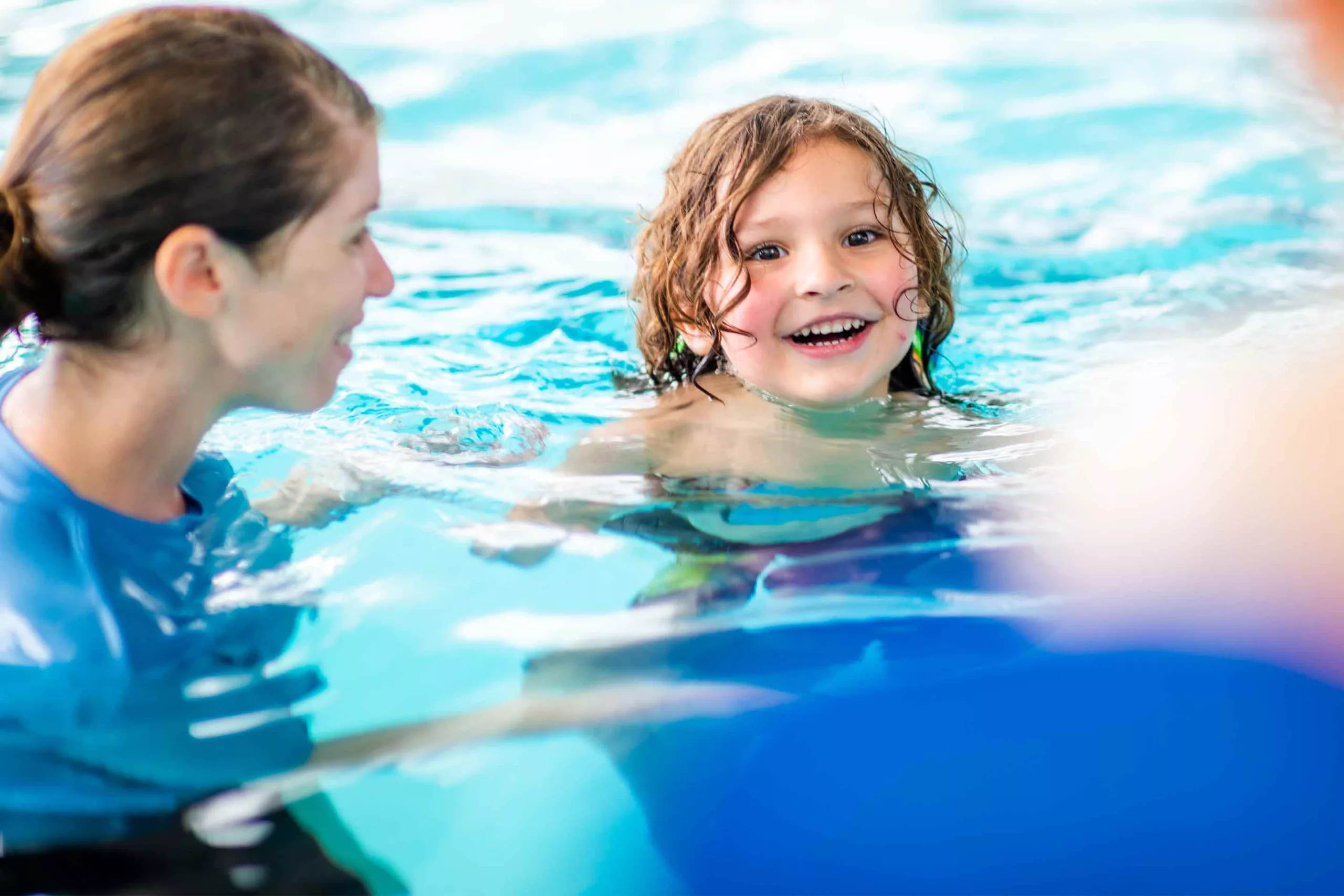 A child learns how to swim