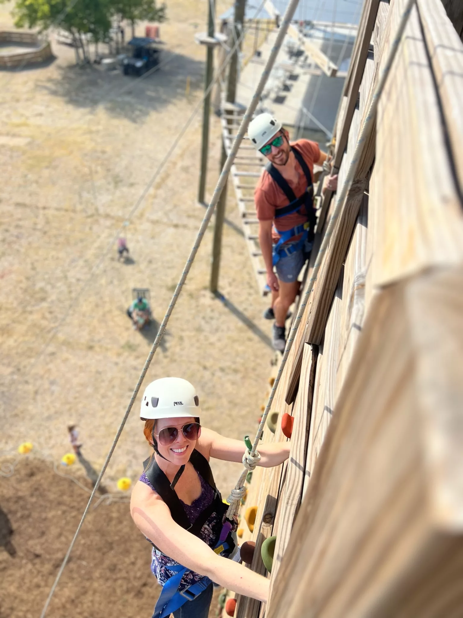 Two participants rock climbing at YMCA Camp Moody