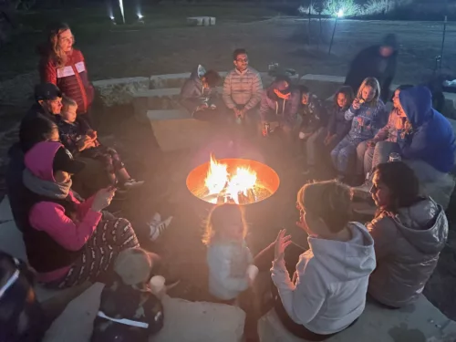 Families gathered around the campfire
