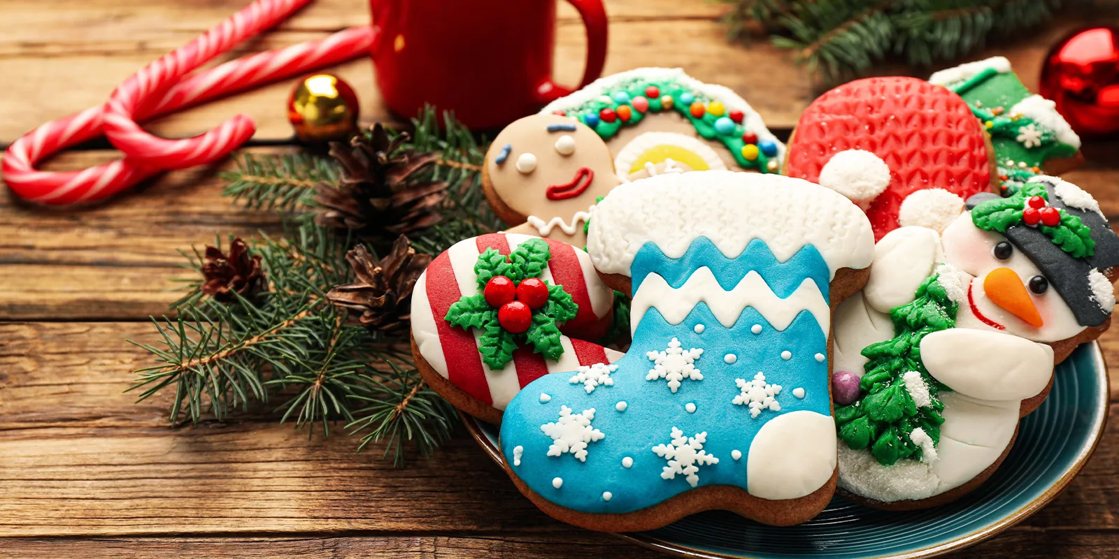 colorful holiday cookies are arranged on a plate